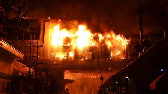 Videos posted on social media showed people falling from a roof after they were trapped by the fire. (AFP)