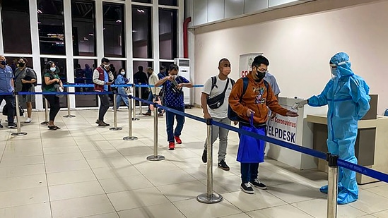 Passengers undergo thermal screening as random Covid-19 testing starts at various airports across the country in the wake of rising cases of Coronavirus globally. (PTI) Passengers undergo thermal screening as random Covid-19 testing starts at various airports across the country in the wake of rising cases of Coronavirus globally. (PTI)