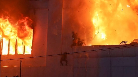 “Right now, we are trying to bring the dead bodies from the building down. I don't think there will be any survivors because of the very thick smoke. Even we all (the rescue staff) have to wear proper gear when we go inside the building, otherwise, we cannot breathe at all,” said Montri Khaosa-ard, a staff member of Thailand Ruamkatanyu Foundation, a social welfare organization that sends volunteers to the sites of emergencies. (AFP)