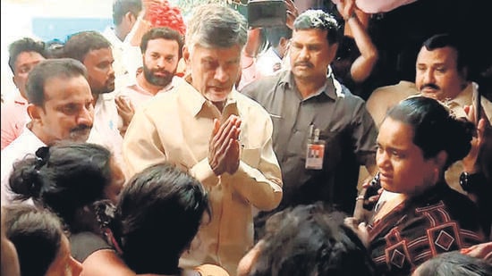 Telugu Desam Party (TDP) national president N Chandrababu Naidu meets the family members of the party workers who died in a stampede that broke out during his public meeting, in the Nellore district of Andhra Pradesh on Thursday. (ANI)