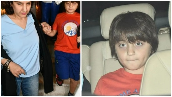 Abram Khan, younger son of Shah Rukh Khan and Gauri Khan, was spotted at a Mumbai restaurant Wednesday evening. He held his iPad as he walked out of the restaurant in an orange tee and blue shorts. (Varinder Chawla)