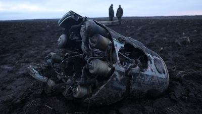 Russia-Ukraine War: Investigators gather near fragments of a munition, what Belarus' defence ministry said were parts of a Ukrainian S-300 missile. (Reuters)