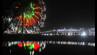 A giant wheel set up at Sector 34 exhibition ground in Chandigarh on Friday amid New Year festivities. (Keshav Singh/HT)