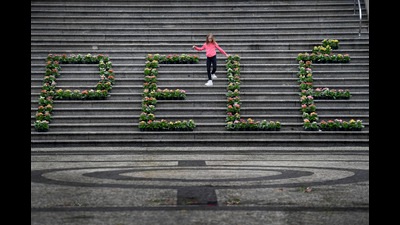 A girl walks among a floral arrangement for the late Brazilian soccer star Pele at the City Hall in Santos, Brazil, December. 30 (AP) A girl walks among a floral arrangement for the late Brazilian soccer star Pele at the City Hall in Santos, Brazil, December. 30 (AP)