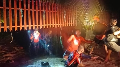 Philippines Floods: Rescuers evacuating people from a flooded area in Ozamiz City, Misamis Occidental. (AFP)