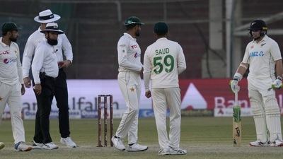 New Zealand's Tom Latham, right, listens to Pakistan's Babar Azam, center, on the end of the first test cricket match between Pakistan and New Zealand, in Karachi, Pakistan, Friday, Dec. 30, 2022. (AP) New Zealand's Tom Latham, right, listens to Pakistan's Babar Azam, center, on the end of the first test cricket match between Pakistan and New Zealand, in Karachi, Pakistan, Friday, Dec. 30, 2022. (AP)