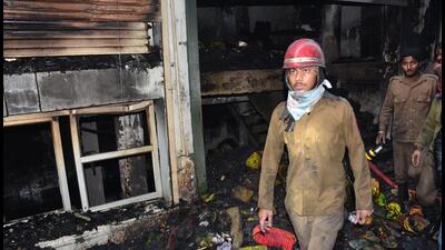 The cause of the fire is suspected to be a short circuit. The incident came to light this morning, when people saw smoke emitting from the hosiery shop in Ludhiana. (HT PHOTO)