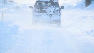 US Winter Storm: Vehicles drive through blowing snow following a winter storm. (Reuters)