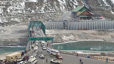 Vehicles seen outside the north portal of the Atal Tunnel in Himachal Pradesh on Monday. (HT Photo) (HT_PRINT)