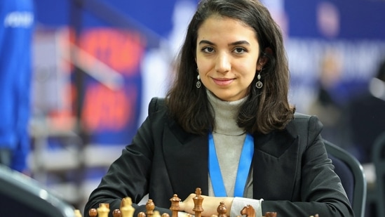 Sara Khadem: Sara Khadem of Iran sits in front of a chess board. (Reuters)