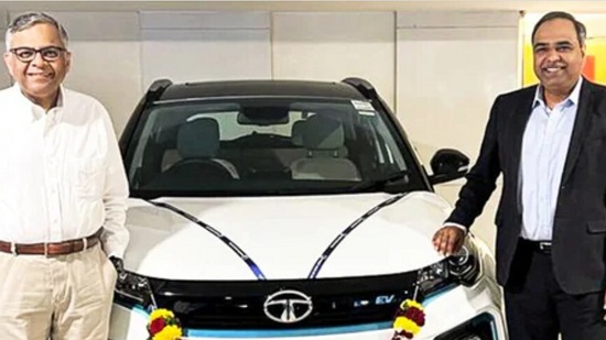 Tata Group chairman N Chandrasekaran (left) was delivered the 50,000th electric car produced by Tata Motors.