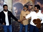 Ram Charan and Jr NTR along with SS Rajamouli at a Mumbai event of RRR. Ram Charan and Jr NTR along with SS Rajamouli at a Mumbai event of RRR.