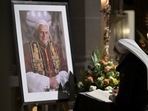 A person signs a book of condolence for Pope Emeritus Benedict XVI at the Saint Magdalena church in Altoetting, Germany (AP Photo)(AP) A person signs a book of condolence for Pope Emeritus Benedict XVI at the Saint Magdalena church in Altoetting, Germany (AP Photo)(AP)