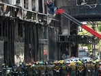 Cambodia Casino Fire: Rescue teams search for victims in a burned out part of the Grand Diamond City hotel-casino.(AFP) Cambodia Casino Fire: Rescue teams search for victims in a burned out part of the Grand Diamond City hotel-casino.(AFP)
