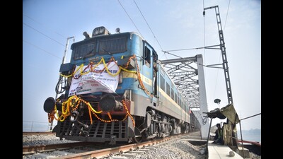 A goods train passing on the new electrified broad gauge DFCCIL double rail line in Prayagraj. (HT photo) A goods train passing on the new electrified broad gauge DFCCIL double rail line in Prayagraj. (HT photo)
