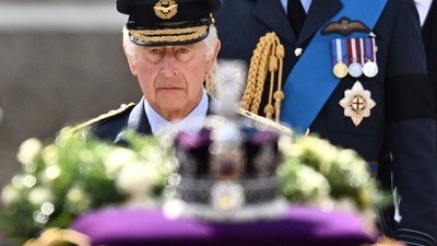 Britain's King Charles III walks behind the coffin of Queen Elizabeth II during a procession from Buckingham Palace to the Palace of Westminster, in London on September 14. (AFP) Britain's King Charles III walks behind the coffin of Queen Elizabeth II during a procession from Buckingham Palace to the Palace of Westminster, in London on September 14. (AFP)