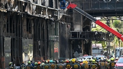 Cambodia Casino Fire: Rescue teams search for victims in a burned out part of the Grand Diamond City hotel-casino. (AFP) Cambodia Casino Fire: Rescue teams search for victims in a burned out part of the Grand Diamond City hotel-casino. (AFP)