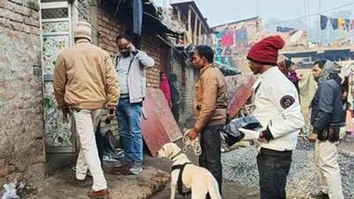 Police personnel along with a sniffer dog inspect the house of the accused Dildar Ansari (Agencies Photo)
