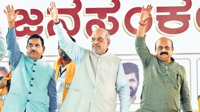 Union Minister Amit Shah with Pralhad Joshi (L) and Karnataka Chief Minister Basavaraj Bommai (R) on Saturday. (PTI) Union Minister Amit Shah with Pralhad Joshi (L) and Karnataka Chief Minister Basavaraj Bommai (R) on Saturday. (PTI)