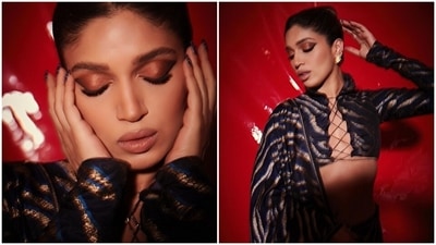 Bhumi chose an animal-printed Benarasi saree for the photoshoot. She draped the six yards aesthetically to show off her risqué full-sleeve blouse by placing the pallu on the shoulder from the back. (Instagram) Bhumi chose an animal-printed Benarasi saree for the photoshoot. She draped the six yards aesthetically to show off her risqué full-sleeve blouse by placing the pallu on the shoulder from the back. (Instagram)