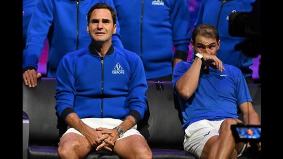 Roger Federer (L) sheds a tear after playing his final match, a doubles with Rafael Nadal. (Photo: Glyn Kirk/ AFP)