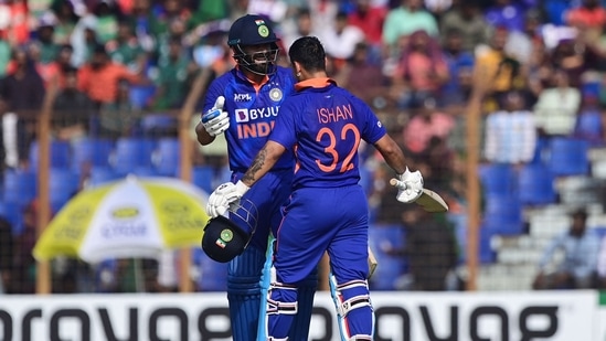 India's Ishan Kishan gestures after scoring a century (100 runs) beside Virat Kohli (L) during the third and final one-day international (ODI) cricket match between Bangladesh and India at the Zahur Ahmed Chowdhury Stadium in Chittagong on December 10, 2022. (Photo by Munir uz ZAMAN / AFP) (AFP)
