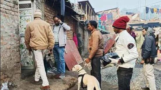 Police personnel along with a sniffer dog inspect the house of the accused Dildar Ansari (Agencies Photo)
