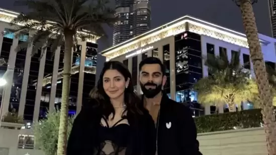 Anushka Sharma and Virat Kohli twin in black and white outfits