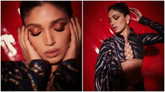 Bhumi chose an animal-printed Benarasi saree for the photoshoot. She draped the six yards aesthetically to show off her risqué full-sleeve blouse by placing the pallu on the shoulder from the back. (Instagram)