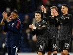 Arsenal's Gabriel Martinelli, Rob Holding and William Saliba celebrate after the match 