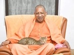 A cat in Yogi Adityanath's lap and his message in tweet(Twitter) A cat in Yogi Adityanath's lap and his message in tweet(Twitter)