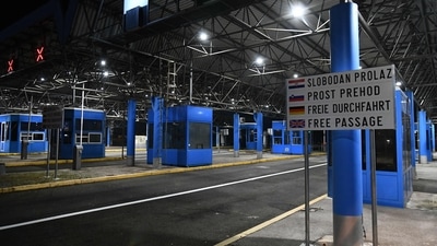 A photograph shows a customs checkpoint as vehicles pass without stopping at the Bregana border crossing between Croatia and Slovenia on January 1. (AFP) A photograph shows a customs checkpoint as vehicles pass without stopping at the Bregana border crossing between Croatia and Slovenia on January 1. (AFP)