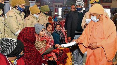 Chief minister Yogi Adityanath listens to the grievances of people during the Janata Darshan programme, in Gorakhpur on Sunday. (CM OFFICE, GoUP,TWITTER/ANI)
