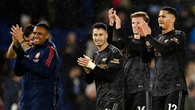 Arsenal's Gabriel Martinelli, Rob Holding and William Saliba celebrate after the match (REUTERS)