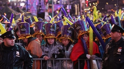 New York Times Square Ball Drop: People gather to celebrate the new year and await the ball drop, in Times Square, New York City. (AFP)
