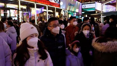Visitors throng a shopping complex on New Year's Eve,amid Covid-19 outbreak in Beijing, China. (REUTERS)
