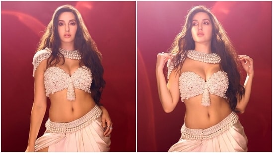Nora Fatehi sets the internet on fire in a pearl deep-neck bralette and thigh-slit skirt. (Instagram)