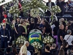 People pay their last respects to the late Brazilian soccer great Pele whose lies in state at Vila Belmiro stadium in Santos, Brazil.(AP) People pay their last respects to the late Brazilian soccer great Pele whose lies in state at Vila Belmiro stadium in Santos, Brazil.(AP)