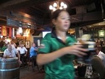 Dubai Alcohol Tax Rule: A waitress serves customers beer at a restaurant in Dubai. Dubai Alcohol Tax Rule: A waitress serves customers beer at a restaurant in Dubai.