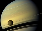 Saturn’s moon Titan is seen here as it orbits the planet. (File photo) (Photo Credit: NASA/ JPL-Caltech/Spac Science Institute) Saturn’s moon Titan is seen here as it orbits the planet. (File photo) (Photo Credit: NASA/ JPL-Caltech/Spac Science Institute)