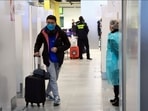 A passenger leaving a Covid-19 testing area at an airport. 