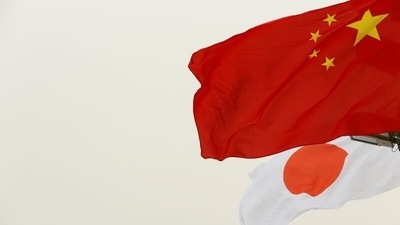 Japan: Chinese and Japanese flags flutter in front of the Tiananmen Gate in Beijing. (Reuters File)