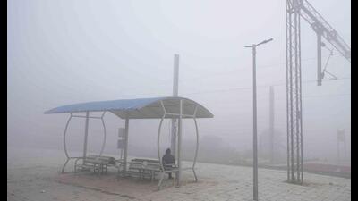 A passenger waits for a train on a cold and foggy morning in Lucknow. (P File Photo)