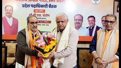UP BJP chief Bhupendra Chaudhary (left) welcomed party national general secretary (organisation) BL Santhosh (wearing off white jacket) as he arrived for a two-day meeting in Lucknow to take stock of party preparedness for forthcoming polls in UP. (Sourced)