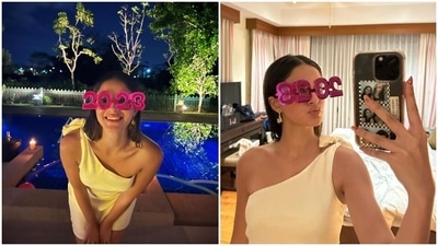 In the end, Ananya styled the look with open centre-parted tresses, quirky earrings, strappy sandals, kohl-lined eyes, glowing skin, glossy nude pink lip shade, and on-fleek brows. (Instagram) In the end, Ananya styled the look with open centre-parted tresses, quirky earrings, strappy sandals, kohl-lined eyes, glowing skin, glossy nude pink lip shade, and on-fleek brows. (Instagram)
