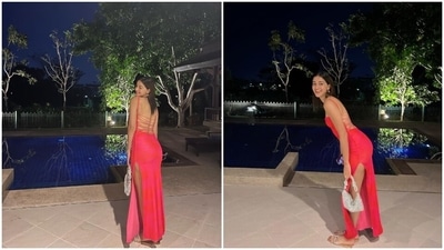 Ananya's outfit for the date night features criss-cross ties, bare back detail, spaghetti straps, a figure-hugging silhouette, a square neckline, and a risqué thigh-high slit on the side. Centre-parted open tresses and minimal makeup rounded it all off. (Instagram) Ananya's outfit for the date night features criss-cross ties, bare back detail, spaghetti straps, a figure-hugging silhouette, a square neckline, and a risqué thigh-high slit on the side. Centre-parted open tresses and minimal makeup rounded it all off. (Instagram)