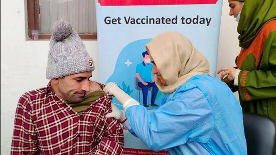 A healthcare worker inoculates a man with a booster dose of Covid-19 vaccine, in Srinagar on Tuesday. (ANI)