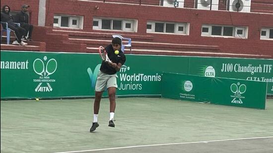 A player in action at the Chandigarh ITF meet inSector 10. (HT Photo)