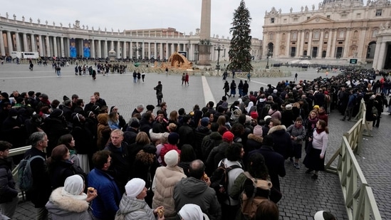 Former Pope Benedict XVI Dies: People wait in a line to enter Saint Peter's Basilica at the Vatican.(AP)