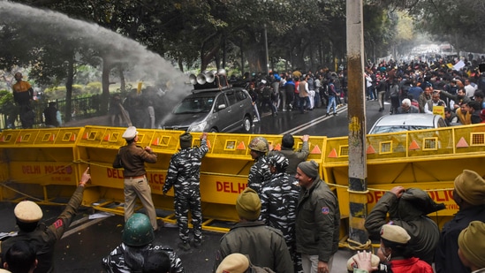 New Delhi: Police use water cannons to disperse the AAP supporters during a protest over Sultanpuri incident, outside Delhi L-G Vinay Saxena's residence, in New Delhi, Monday.(PTI)